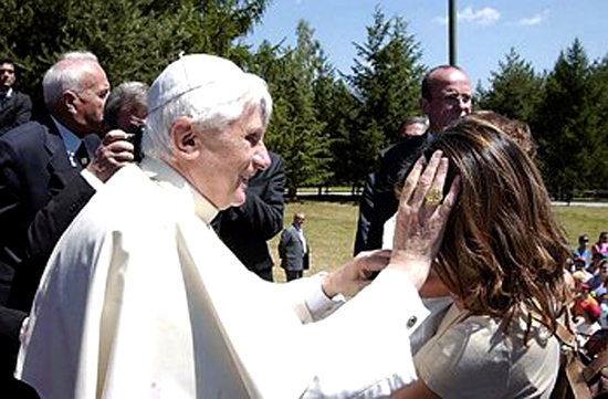 Benedict XVI caressing a woman on her forehead